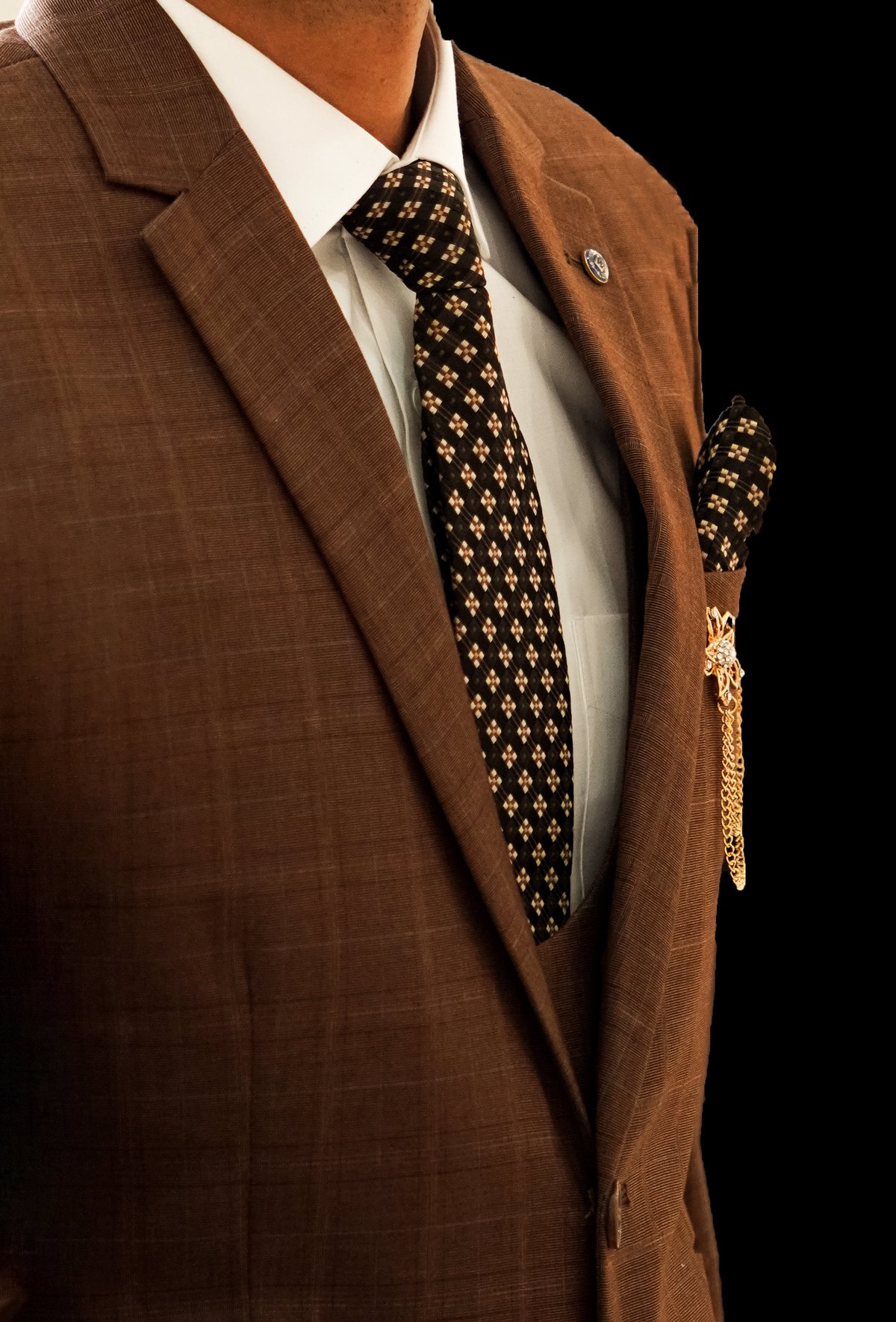 Impeccable suiting accented with pocket square or brooch