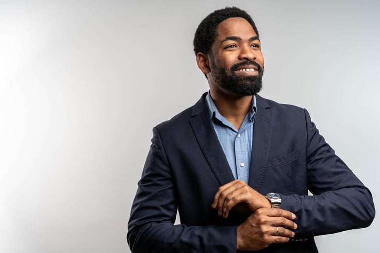 Black businessman adjusting cufflink wearing luxury tailored suit